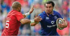  ??  ?? In fine form: James Lowe pushes past Simon Zebo