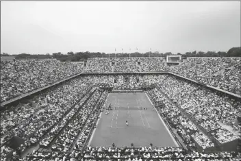  ?? ASSOCIATED PRESS ?? IN THIS JUNE 10, 2018, FILE PHOTO, the crowd watches Austria’s Dominic Thiem serving to Spain’s Rafael Nadal during the men’s final match of the French Open tennis tournament at the Roland Garros stadium in Paris.