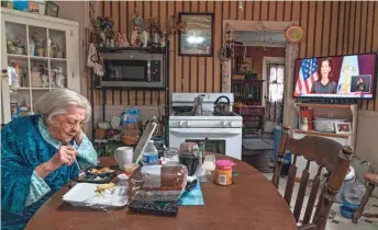  ?? DAVID GOLDMAN/AP ?? Rita Scanlon, 92, eats lunch delivered to her by Meals on Wheels of Rhode Island last year.