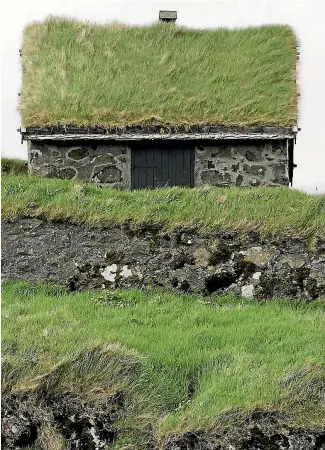  ?? PHOTO: REUTERS ?? An example of a traditiona­l Faroese house in Torshavn.