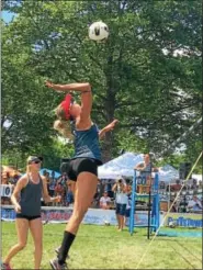  ?? ERIC DEVLIN — DIGITAL FIRST MEDIA ?? Agnieszka Pregowska is about to spike a volleyball during the Pottstown Rumble Sunday. She and her teammate Aleksandra Wachowicz won the $3,000 grand prize in the women’s tournament.