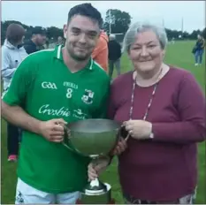  ??  ?? Caroline Foxe presents the cup to Mark Molloy of St. James’.