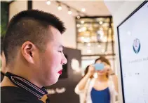  ?? REUTERS ?? A KFC customer tries Alipay’s facial recognitio­n payment solution “Smile to Pay” at KFC’s new KPRO restaurant in Hangzhou, Zhejiang province, China, Sept. 1.