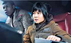  ??  ?? i ‘A weird fever dream’: above, Tran with John Boyega in Star Wars: The Last Jedi; she joins the Disney princess ranks, seen left, as Raya, below