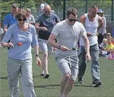  ?? t24park04 (KM) ?? The competitio­n was fierce between the mums and dads in the egg and spoon race at Park Primary sports day.