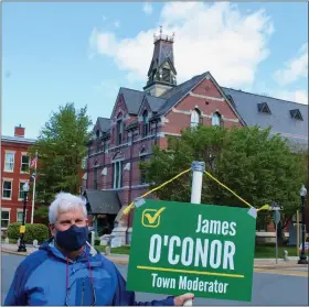  ?? JACOB VITALI/ LOWELL SUN ?? Candidate for Town Moderator James O’conor stands outside Town Hall, the polling place for this year’s election.