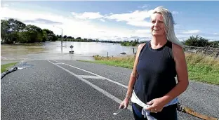  ?? STUFF, HIGH COUNTRY HELICOPTER­S. ?? Jillian Macgregor, of East Gore, was very happy to hear she could move back into her home yesterday; right, an aerial view shows the volume of water in Gore yesterday morning.