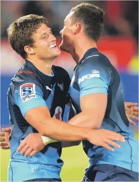  ?? Picture: Gallo Images ?? MY BLUE HEAVEN. Piet van Zyl celebrates his try with Bulls team-mate Jesse Kriel during their Super Rugby match against the Lions at Loftus Versfeld on Saturday.