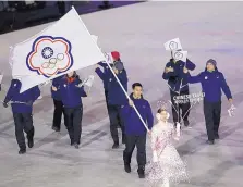  ?? AP FILE ?? Taiwanese athletes carry the Chinese Taipei flag during the opening ceremony of the 2018 Winter Olympics in February.