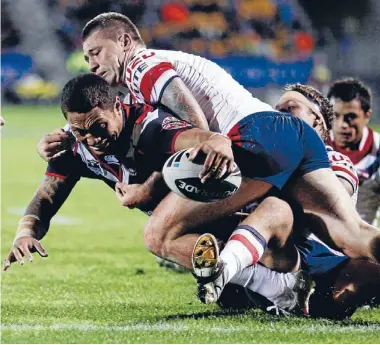  ??  ?? Regular delivery: Manu Vatuvei scores for the Warriors against the Roosters in Auckland on Saturday. Photo: Shane Wenzlick/fairfax NZ