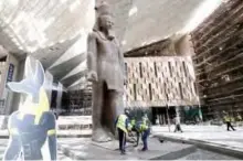  ??  ?? This picture shows the 3,200-year-old pink-granite colossal statue of King Ramses II at the entrance of the Grand Egyptian Museum under constructi­on in Giza on the southweste­rn outskirts of the capital Cairo.