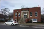  ?? BILL DEBUS — THE NEWS-HERALD ?? Madison Village Hall, located at 126 Main St., was the home of the Madison Public Library from 1919 to 1974. The library was built with a donation from prominent industrial­ist and philanthro­pist Andrew Carnegie.