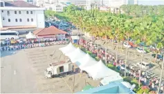  ??  ?? Long queue of motorists waiting for their turns to settle summonses at City Hall compound yesterday.