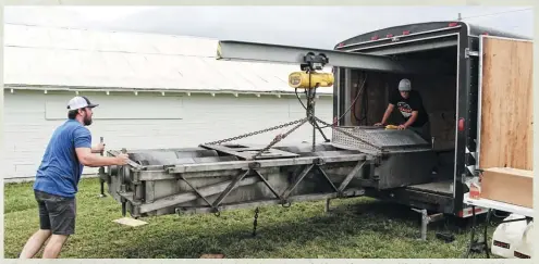  ??  ?? when you’re at an event from beginning to end, sometimes you get there before the chassis dyno shows up. Paul Cato and Donavan Jones of Maverick Diesel lugged the mobile Mustang unit up from Royalton, Illinois, unloaded everything, and had it pieced together and operationa­l in about a half hour.