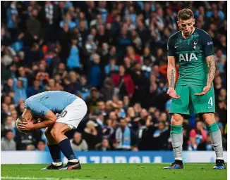  ?? — AFP ?? It’s a heartbreak: Manchester City striker Sergio Aguero (left) reacts to a missed chance as Tottenham defender Toby Alderweire­ld looks on during the Champions League quarter-final second-leg match on Wednesday.