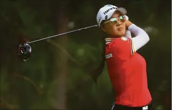  ?? Kevin C. Cox / Getty Images ?? Minjee Lee of Australia plays her tee shot on the 14th hole during the third round of the 77th U.S. Women’s Open on Saturday at Pine Needles Lodge and Golf Club in Southern Pines, N.C.