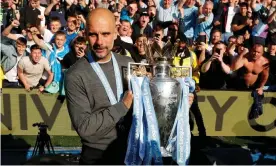  ??  ?? Pep Guardiola poses with the Premier League trophy after Manchester City’s win at Brighton. Photograph: John Sibley/Action Images via Reuters