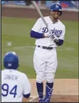  ?? Associated Press ?? BIG YEAR — The Dodgers’ Mookie Betts reacts after being hit by a pitch against the Angels on Saturday. Betts and the Dodgers will face Devin Williams and the Brewers in the first round of the playoffs starting on Wednesday.