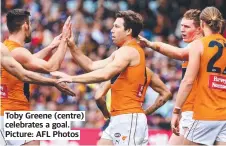 ?? ?? Toby Greene (centre) celebrates a goal. Picture: AFL Photos