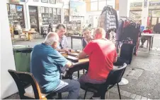  ?? ?? Men play tavleh in a cafe in the market of the the Turkish-controlled side of the divided Cypriot capital Nicosia.