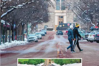  ?? EDDIE MOORE/JOURNAL ?? TOP: Sage Heyman and Michael Royle, from Santa Fe, walk across Lincoln Avenue on Wednesday. INSET : Thousands of people crowd Lincoln Avenue and downtown during Santa Fe Indian Market in 2011. The Indian Market was canceled in 2020 due to the COVID-19 pandemic.