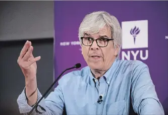  ?? SPENCER PLATT GETTY IMAGES ?? New York University professor Paul Romer speaks at a news conference Monday after being named a winner of the 2018 Nobel Prize in economics. He says he’s optimistic society can solve the global warming threat.