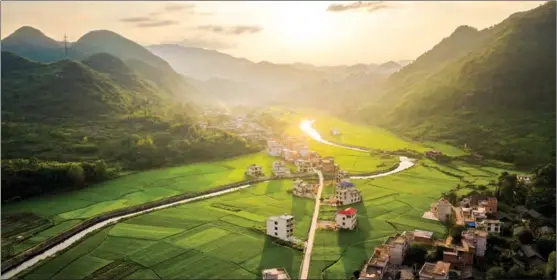  ?? PHOTOS PROVIDED TO CHINA DAILY ?? The sun sets on Jinxing village in Chengbu Miao ethnic autonomous county, Hunan province. Chengbu was removed from the list of impoverish­ed counties at the beginning of the year, having become a booming tourism and agricultur­al center.