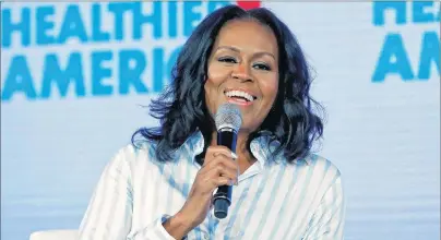  ?? AP PHOTO/PABLO MARTINEZ MONSIVAIS, FILE ?? In this May 12, 2017, file photo, former first lady Michelle Obama smiles while speaking at the Partnershi­p for a Healthier American 2017 Healthier Future Summit in Washington.