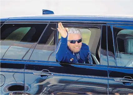  ?? ROBERTO E. ROSALES/JOURNAL ?? Sir Richard Branson waves to onlookers Sunday morning before boarding his passenger rocket ship VSS Unity to head to space.