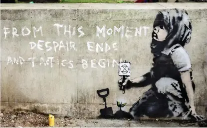  ??  ?? Leaving a mark: The artwork near the Extinction Rebellion protesters’ Marble Arch base
