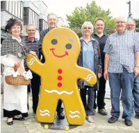  ?? Organisers and the public with a giant gingerbrea­d man at last year’s festival ??