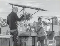  ??  ?? Director Alfonso Cuaron, left, and actress Yalitza Aparicio on the set of Roma.