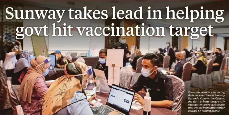  ??  ?? Frontline workers receiving their vaccinatio­ns at Sunway Pyramid Convention Centre, the first private large-scale vaccinatio­n centre in Malaysia that will see immunisati­on for at least 1.8 million people.