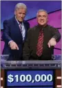  ?? PROVIDED BY ‘JEOPARDY!’/FILE ?? MAY 17: New Paltz resident Francois Barcomb, right, shown with ‘Jeopardy!’ host Alex Trebek, wins the game show’s $100,000 Teachers Tournament.