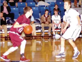  ?? MARK HUMPHREY ENTERPRISE-LEADER ?? Lincoln reserve Dalton Barnum controls the dribble against Shiloh Christian. The Wolves came from behind on Feb. 19 to defeat the Saints on their home court, 55-50, to reach the District 4A-1 semifinals.