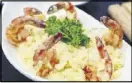  ?? CONTRIBUTE­D BY DIEGO DINIZ ?? Tutto Kitchen & Bar offers a variety of pasta and seafood dishes, including this rich and creamy shrimp risotto.