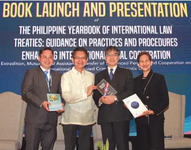  ?? PNA photo ?? THE DEPARTMENT of Foreign Affairs (DFA) and the University of the Philippine­s (UP) Press Book launch the “Philippine Yearbook of Internatio­nal Law”, “Treaties: Guidance on Practices and Procedures”, and “Enhancing Internatio­nal Legal Cooperatio­n” at the Monet Ballroom of Novotel Hotel in Cubao, Quezon City. At the event were (from left) Prof. Rommel Casis, director of the Institute of Internatio­nal Legal Studies; DFA Undersecre­tary for Administra­tion J. Eduardo Malaya; Judge Yuji Iwasawa of the Internatio­nal Court of Justice; and Dean Fides Cordero Tan of the UP College of Law.