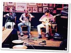  ?? ?? DRINK IT IN: Musicians hard at work in a bar.
Top: The stunning view from the cliffs of Slieve League