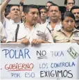  ?? MIGUEL GUTIERREZ, EPA ?? Workers of Empresas Polar demonstrat­e outside the company headquarte­rs in Caracas, Venezuela, on April 22.
