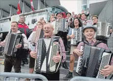  ?? PETER LEE WATERLOO REGION RECORD ?? Canada’s Polka King Walter Ostanek, centre, and his band perform at city hall for the official opening of KitchenerW­aterloo Oktoberfes­t 2018