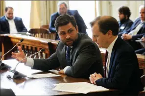  ?? Arkansas Democrat-Gazette/THOMAS METTHE ?? Sen. Jonathan Dismang (left) confers Wednesday with Paul Gehring, assistant commission­er of the Department of Finance and Administra­tion, during a committee hearing on House Bill 1565. More photos at arkansason­line.com/314genasse­mbly/