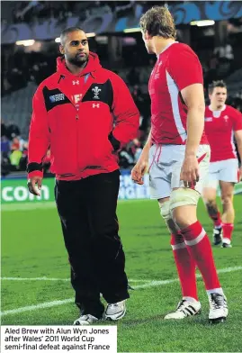  ??  ?? Aled Brew with Alun Wyn Jones after Wales’ 2011 World Cup semi-final defeat against France