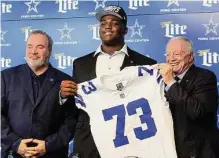  ?? Amanda Mccoy / Fort Worth Star-telegram ?? Coach Mike Mccarthy and owner Jerry Jones raved about Smith’s potential after selecting him No. 24 overall.