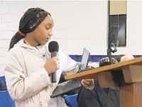  ?? MIKE HOLTZCLAW/STAFF ?? Nevaeh Robinson, an eighth-grader from Huntington who is currently attending Crittenden Middle School, speaks to the Newport News School Board on Tuesday at the Marshall Early Learning Center during a meeting about Huntington’s fate.