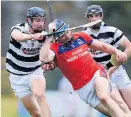  ??  ?? CLOSE ENCOUNTER Turloughmo­re’s Sean Loftus & St Thomas’ Conor Cooney