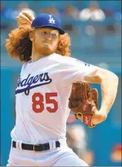  ?? Jayne Kamin-Oncea Getty Images By Jack Harris ?? ROOKIE DUSTIN MAY has risen to the ocassion in two starts since being called up this month.