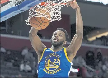  ?? CARLOS OSORIO — THE ASSOCIATED PRESS ?? Warriors forward Andrew Wiggins dunks during the second half against the Pistons on Friday in Detroit.