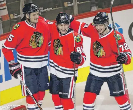  ??  ?? The line of Artem Anisimov (from left), Patrick Kane and Artemi Panarin has scored 31 of the Hawks’ 67 goals this season.