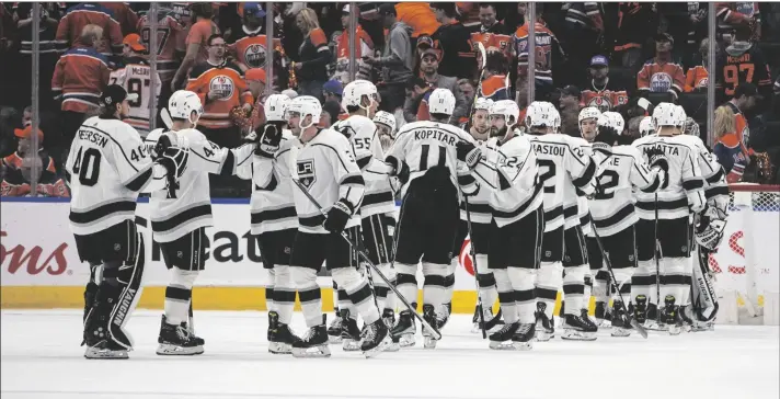  ?? PHOTO VIA AP ?? Los Angeles Kings celebrate the win over the Edmonton Oilers after Game 1 of an NHL hockey Stanley Cup first-round playoff series on Monday in Edmonton, Alberta.