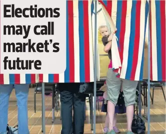  ?? By Don Emmert, Afp/getty Images ?? Elections may call market’s future
Next? Landon Peterson peeks out of the voting booth as his mother, Meghan, votes in Illinois’ March 20 primary.